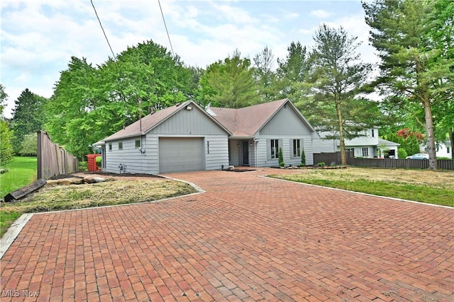 8848 King Graves Rd NE, Warren, OH 44484 - single story home featuring an attached garage, decorative driveway, and board and batten siding