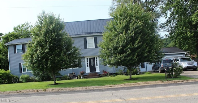 230 Rivercrest Dr, Coshocton, OH 43812 - view of property hidden behind natural elements featuring entry steps, a front lawn, and metal roof