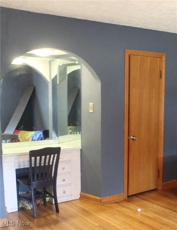 230 Rivercrest Dr, Coshocton, OH 43812 - office with arched walkways, light wood-style flooring, and baseboards