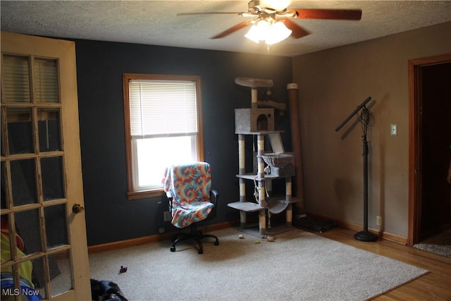 230 Rivercrest Dr, Coshocton, OH 43812 - sitting room with ceiling fan, a textured ceiling, baseboards, and wood finished floors