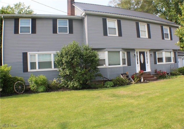 230 Rivercrest Dr, Coshocton, OH 43812 - view of front of house with entry steps, a front yard, and a chimney