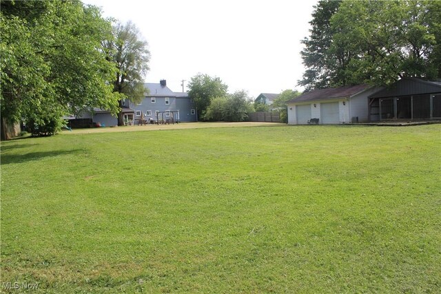 230 Rivercrest Dr, Coshocton, OH 43812 - view of grassy yard with a garage