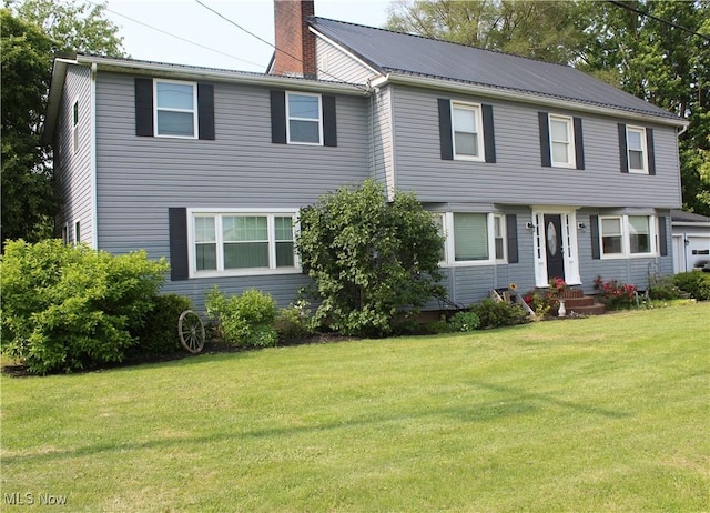 230 Rivercrest Dr, Coshocton, OH 43812 - view of front of property featuring a chimney, a front lawn, entry steps, and metal roof