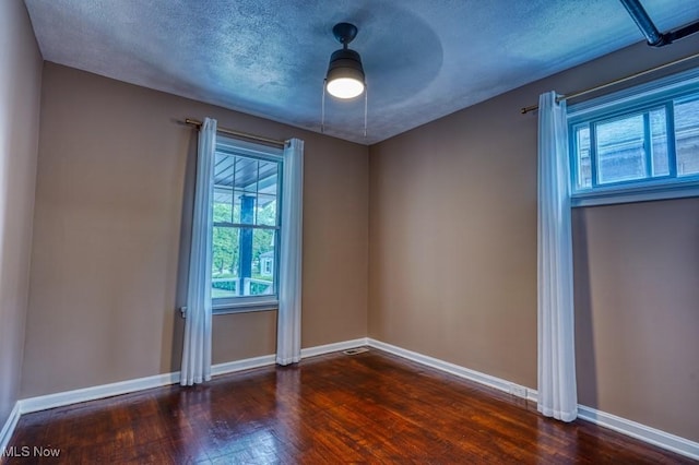 8208 Vista Ave, Garfield Heights, OH 44125 - unfurnished room with wood finished floors, baseboards, and a ceiling fan
