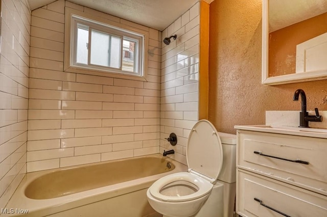 8208 Vista Ave, Garfield Heights, OH 44125 - full bath featuring a textured wall, toilet, vanity, and bathtub / shower combination
