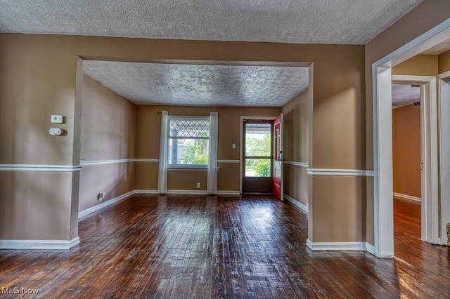 8208 Vista Ave, Garfield Heights, OH 44125 - unfurnished room with a textured ceiling, hardwood / wood-style floors, and baseboards