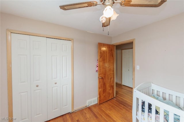 29431 Fairway Blvd, Willowick, OH 44095 - bedroom with light wood finished floors, a closet, and a ceiling fan