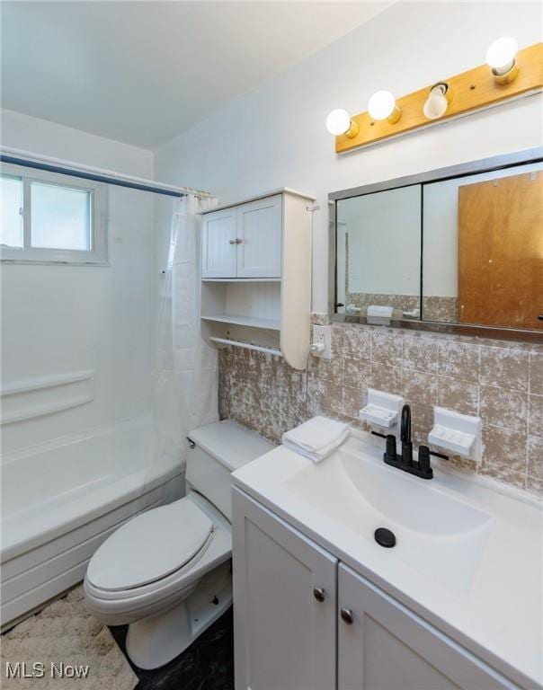 29431 Fairway Blvd, Willowick, OH 44095 - full bath with vanity, decorative backsplash, and shower / tub combo