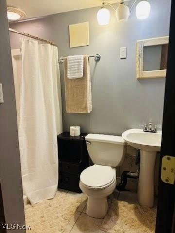 29431 Fairway Blvd, Willowick, OH 44095 - bathroom featuring toilet and a shower with curtain