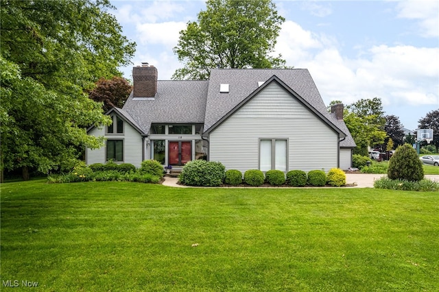 118 Steeplechase Ln, Munroe Falls, OH 44262 - view of front facade featuring a chimney, a front yard, and roof with shingles