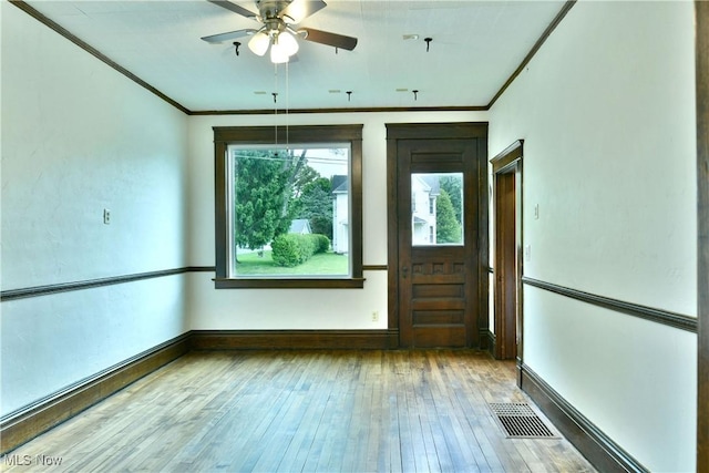 8273 Warren Meadville Rd, Kinsman, OH 44428 - empty room featuring ornamental molding, ceiling fan, wood-type flooring, and baseboards