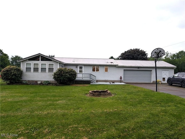 46340 Township Rd Unit 1208, Coshocton, OH 43812 - ranch-style home featuring asphalt driveway, a garage, a front lawn, and metal roof