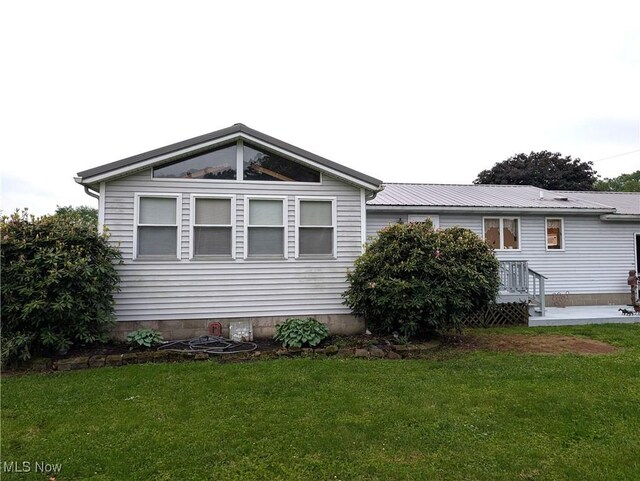 46340 Township Rd Unit 1208, Coshocton, OH 43812 - view of side of property featuring a lawn and metal roof