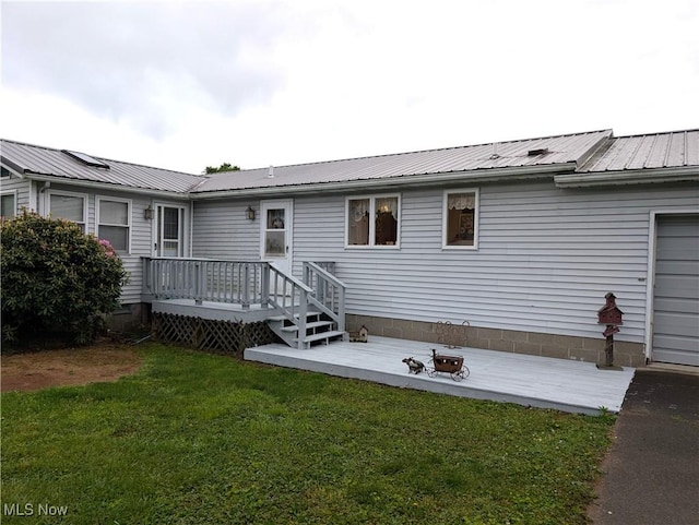 46340 Township Rd Unit 1208, Coshocton, OH 43812 - rear view of house with a deck, a lawn, and metal roof