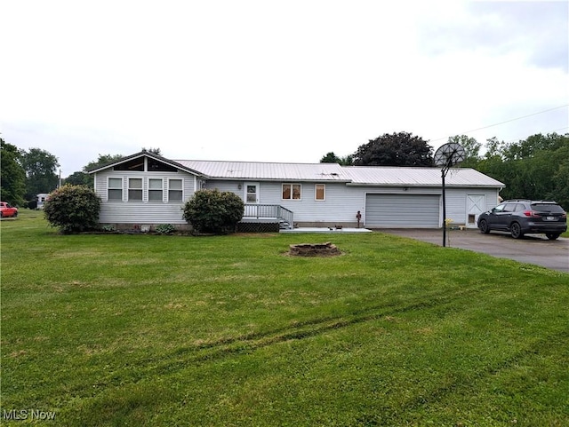 46340 Township Rd Unit 1208, Coshocton, OH 43812 - ranch-style home featuring a front lawn, an attached garage, metal roof, and driveway
