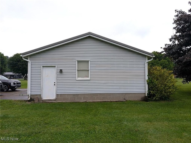46340 Township Rd Unit 1208, Coshocton, OH 43812 - back of house featuring a yard