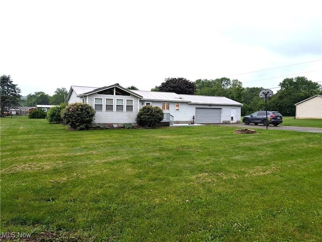 46340 Township Rd Unit 1208, Coshocton, OH 43812 - view of front of home featuring an attached garage, driveway, and a front yard