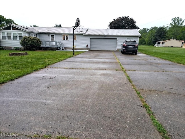46340 Township Rd Unit 1208, Coshocton, OH 43812 - ranch-style home with a front yard, asphalt driveway, an attached garage, and metal roof