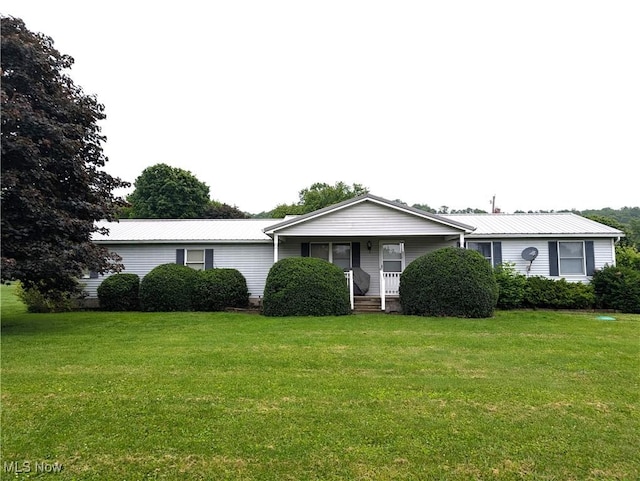 46340 Township Rd Unit 1208, Coshocton, OH 43812 - view of front facade featuring covered porch, a front yard, and metal roof