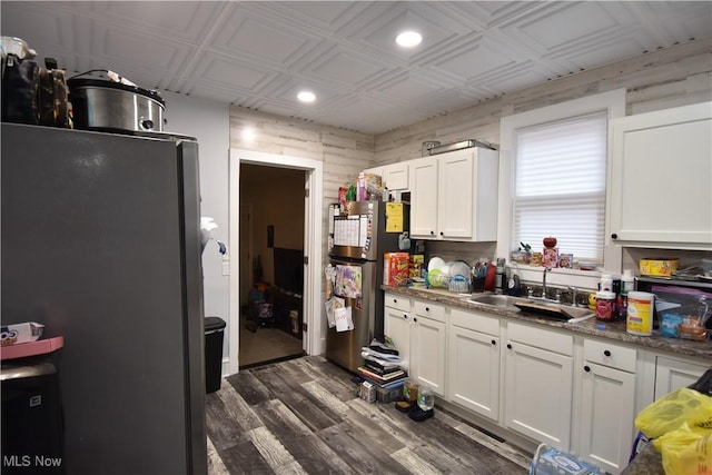 70 N Chestnut St, Jefferson, OH 44047 - kitchen featuring a sink, freestanding refrigerator, an ornate ceiling, dark wood-style floors, and white cabinets