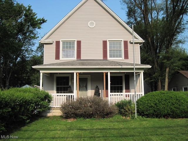 2710 W River Rd N, Elyria, OH 44035 - view of front of house featuring covered porch and a front yard