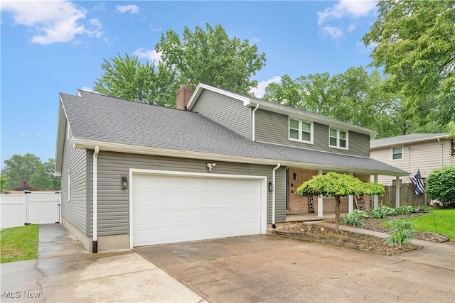 8457 Deer Crk NE, Warren, OH 44484 - traditional home featuring driveway, a chimney, a garage, a porch, and a shingled roof