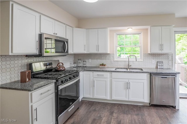1105 E Blvd, Aurora, OH 44202 - kitchen with appliances with stainless steel finishes, a sink, white cabinets, and stone countertops