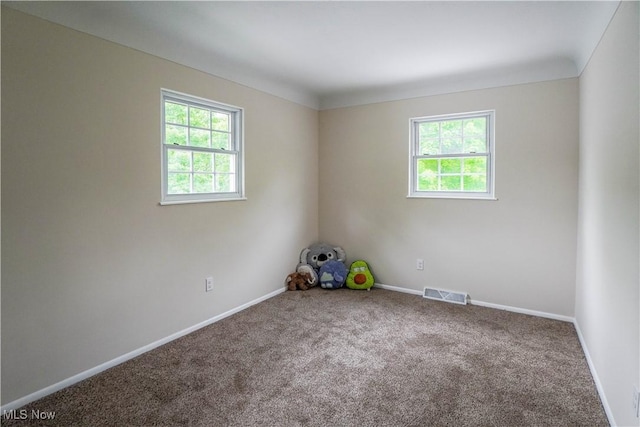 1105 E Blvd, Aurora, OH 44202 - carpeted empty room with healthy amount of natural light and baseboards
