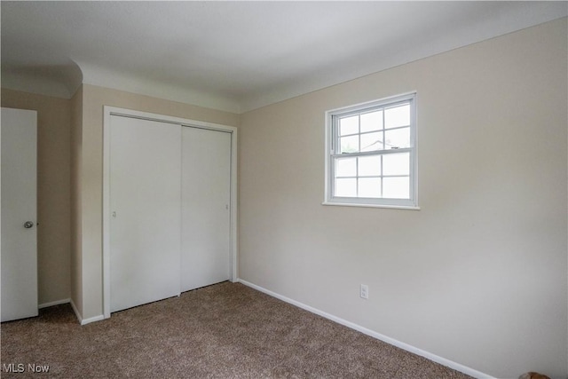 1105 E Blvd, Aurora, OH 44202 - unfurnished bedroom with carpet floors, a closet, and baseboards