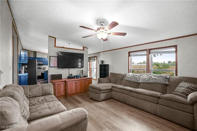3764 US Highway 224 E Lot 92, Greenwich, OH 44837 - living room with light wood-style floors, ceiling fan, a textured ceiling, vaulted ceiling, and crown molding