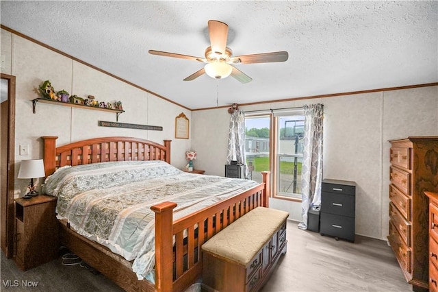 3764 US Highway 224 E Lot 92, Greenwich, OH 44837 - bedroom with crown molding, vaulted ceiling, a textured ceiling, light wood-type flooring, and a ceiling fan