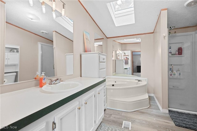 3764 US Highway 224 E Lot 92, Greenwich, OH 44837 - full bath featuring vaulted ceiling, wood finished floors, vanity, a shower stall, and a skylight