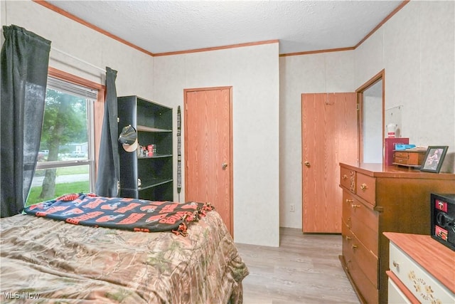 3764 US Highway 224 E Lot 92, Greenwich, OH 44837 - bedroom featuring crown molding, light wood-style flooring, and a textured ceiling