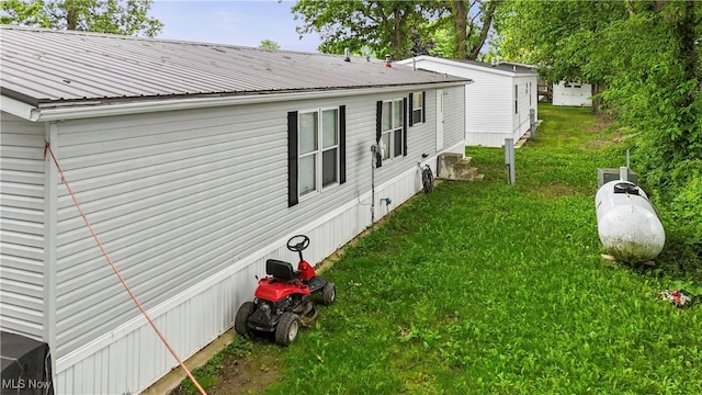 3764 US Highway 224 E Lot 92, Greenwich, OH 44837 - view of side of home with a lawn and metal roof