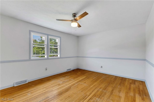 868 King George Blvd, South Euclid, OH 44121 - empty room with light wood-style floors, a ceiling fan, and baseboards