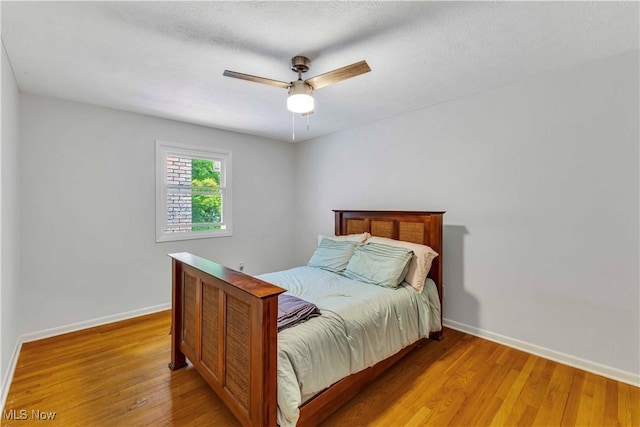868 King George Blvd, South Euclid, OH 44121 - bedroom with baseboards, light wood-style floors, and ceiling fan