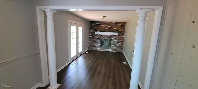 445 Houghton Rd, Sagamore Hills, OH 44067 - unfurnished living room with dark wood finished floors, baseboards, a fireplace, and french doors