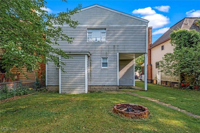 832 Wellman Ave SE, Massillon, OH 44646 - rear view of property with an outdoor fire pit