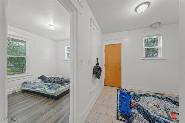 832 Wellman Ave SE, Massillon, OH 44646 - bedroom featuring baseboards and light tile patterned flooring