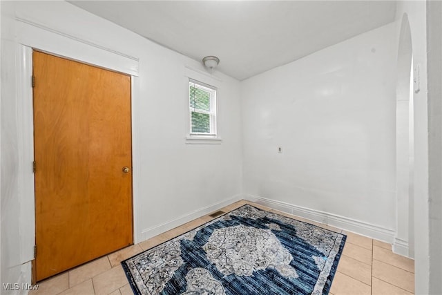 832 Wellman Ave SE, Massillon, OH 44646 - spare room featuring light tile patterned floors and baseboards