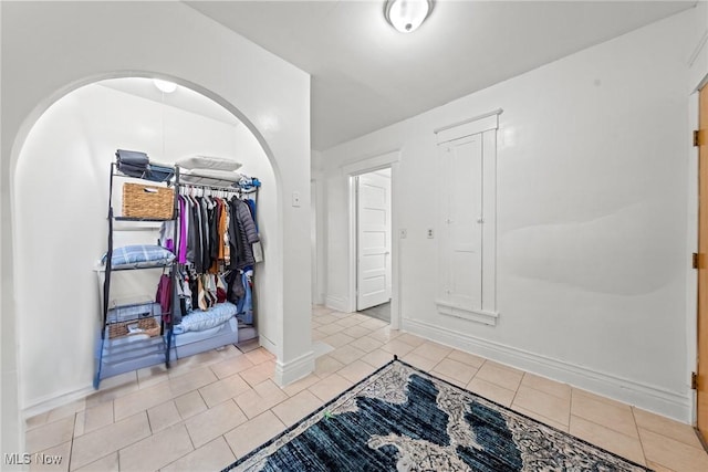 832 Wellman Ave SE, Massillon, OH 44646 - foyer entrance featuring tile patterned floors and baseboards