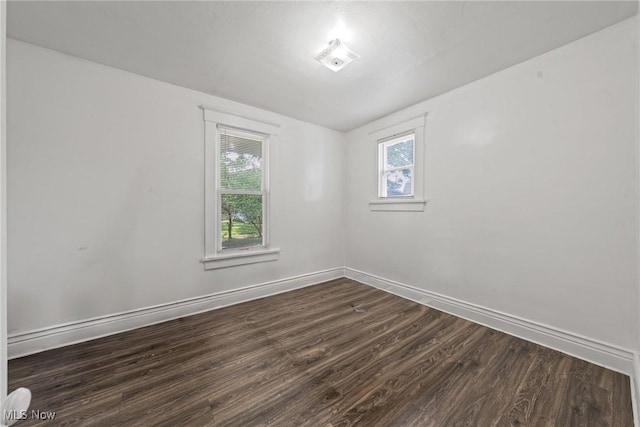 832 Wellman Ave SE, Massillon, OH 44646 - unfurnished room with dark wood-style floors and baseboards