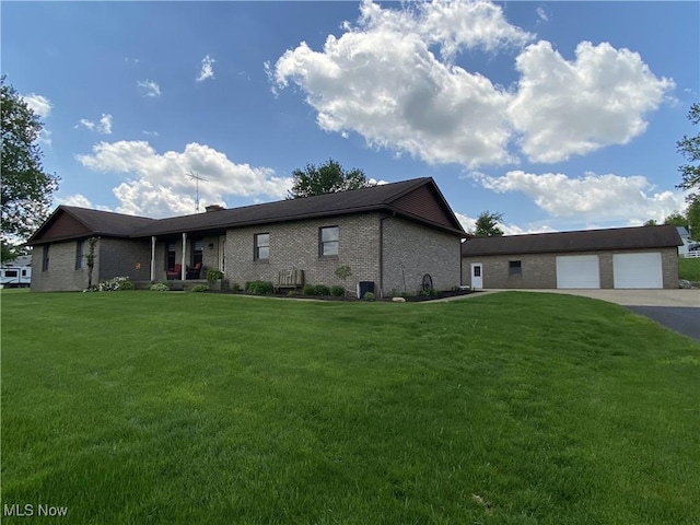 14035 Dover Rd, Apple Creek, OH 44606 - ranch-style home featuring brick siding, a front lawn, and an outdoor structure