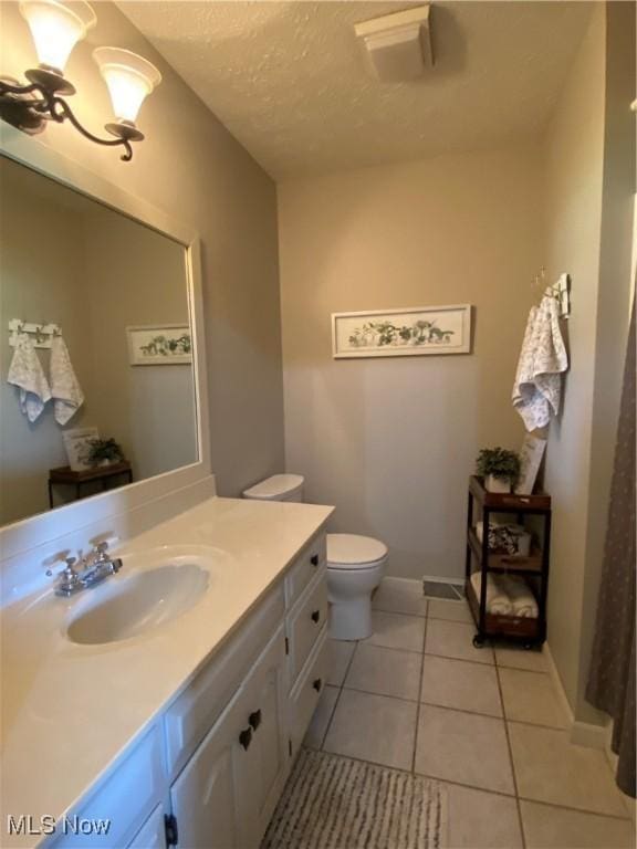 14035 Dover Rd, Apple Creek, OH 44606 - bathroom featuring vanity, tile patterned flooring, toilet, and baseboards