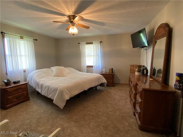 14035 Dover Rd, Apple Creek, OH 44606 - bedroom featuring light carpet, a textured ceiling, a ceiling fan, and baseboards
