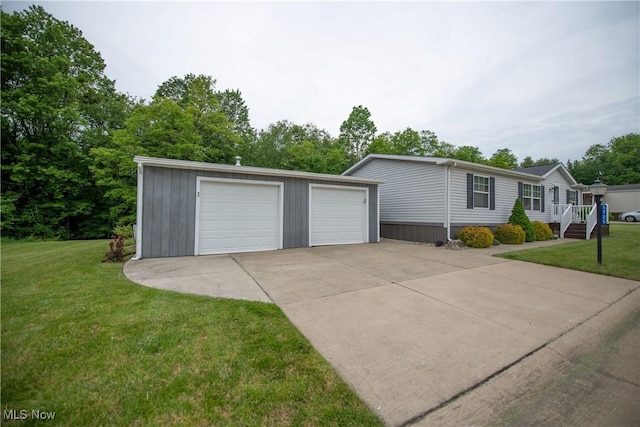5725 Joleda Dr SW, Canton, OH 44706 - view of front of home with a detached garage, an outdoor structure, and a front lawn