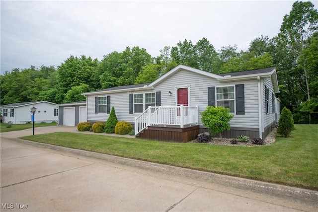 5725 Joleda Dr SW, Canton, OH 44706 - manufactured / mobile home with a front lawn and a detached garage