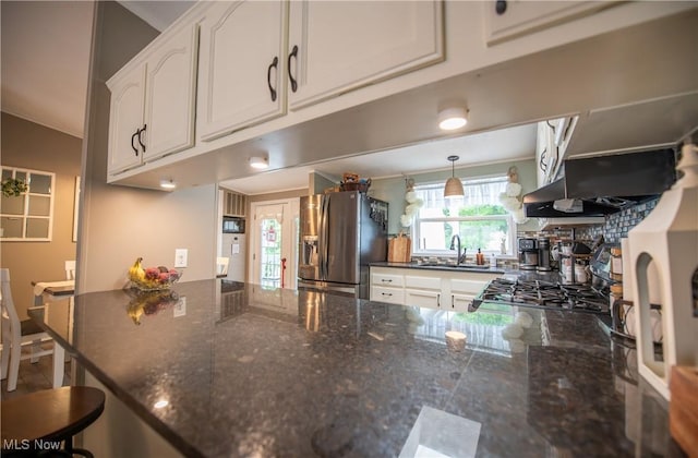 5725 Joleda Dr SW, Canton, OH 44706 - kitchen featuring stainless steel fridge with ice dispenser, a sink, white cabinets, a peninsula, and dark stone countertops