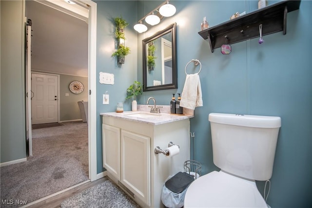 5725 Joleda Dr SW, Canton, OH 44706 - bathroom featuring vanity, toilet, and baseboards