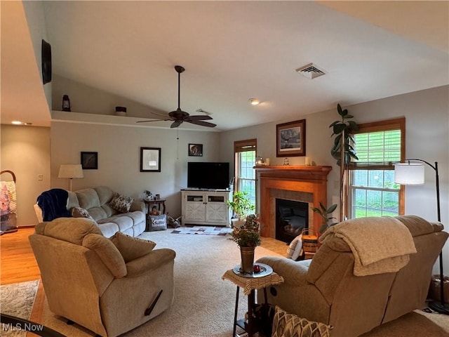 617 Wedgewood Way Unit 617, Millersburg, OH 44654 - living area with healthy amount of natural light, ceiling fan, a tiled fireplace, and vaulted ceiling